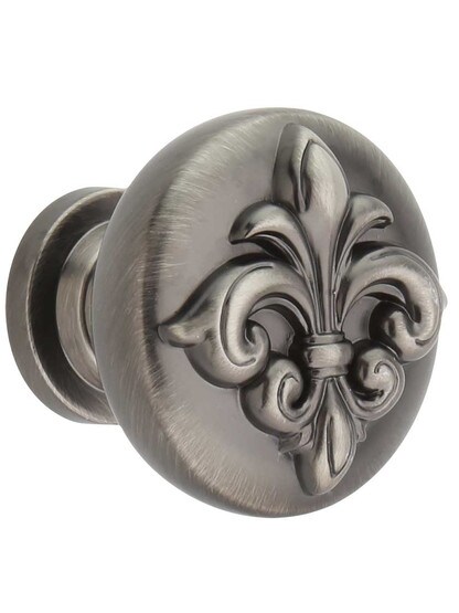 Lafayette Raised Fleur-De-Lis Cabinet Knob - 1 3/8 inch Diameter in Brushed Pewter.